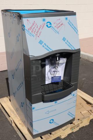 Manitowoc SPA162-161 touchless hotel ice dispenser, new scratch-n-dent condition, 22", 115V, 120 lb capacity, with protective covering.