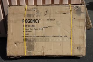Regency 600TB3048G work table packaging, marked with "18 Gauge Work Table 30x48", new condition, visible wear on box.