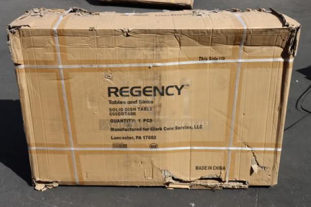 Cardboard box labeled "Regency 600DDT48R Soiled Dish Table," slightly damaged. Contains new 4' dish table with right drainboard.