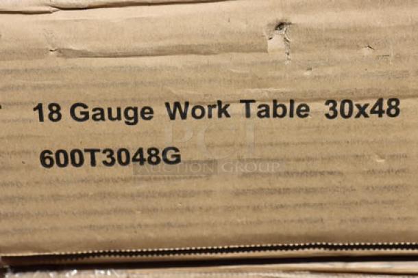 Cardboard box displaying "18 Gauge Work Table 30x48 600T3048G" text, indicating model and specifications.