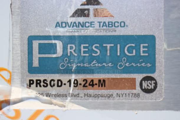 Advance Tabco PRSCD-19-24-M label on stainless steel drainboard cabinet, Prestige Series, NSF certified, Hauppauge, NY.