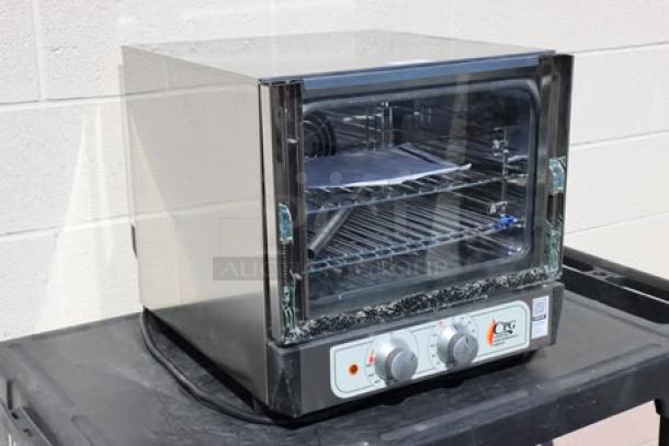 BRAND NEW Cooking Performance Group COQ-T3-A electric convection oven, 3 tray, 120V, 1,650W, glass broken. Model: COQ-T3-A.