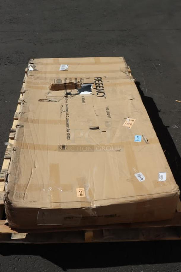 BRAND NEW Regency 600TSB3060S 30"x60" 16-Gauge Stainless Steel Work Table with damaged box on pallet.