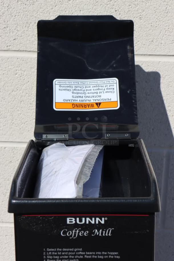 Bunn 22100.0000 G3 HD black bulk coffee grinder, new, scratch-n-dent condition. Visible warning label inside lid.