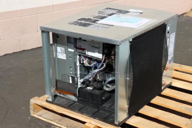 Ice-O-Matic CIM0530HA90 ice machine, air-cooled, half dice cube, 525 lb capacity, new with scratch and dent, visible serial number.