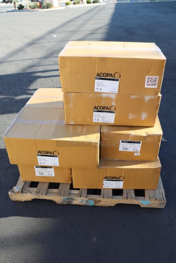 Alt text: "Stacked boxes of Acopa 553AQCMH16 Moscow Mule Mugs on pallet. 8 cartons, each with 12 hammered dark antique copper mugs."