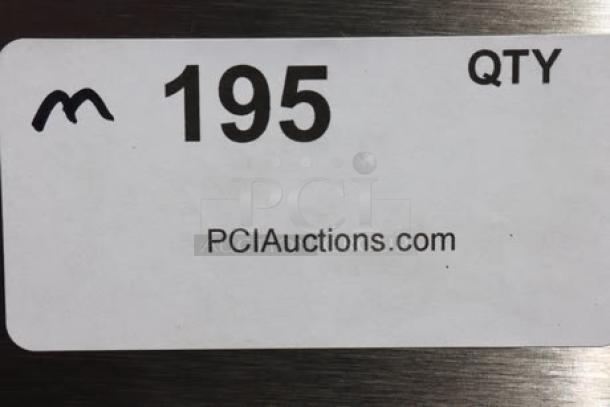Label showing "195 QTY" and "PCIAuctions.com" on stainless steel surface.