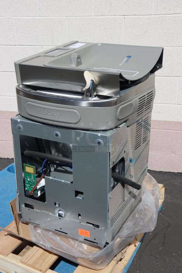 Brand new Zurn Elkay LZSTL8WSSK hands-free bottle filling station, scratch-n-dent condition, with tags visible.