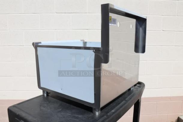 Steelton Model 522US12424 stainless steel bin, brand new with minor dents on edges; durable, ideal for heavy-duty use.