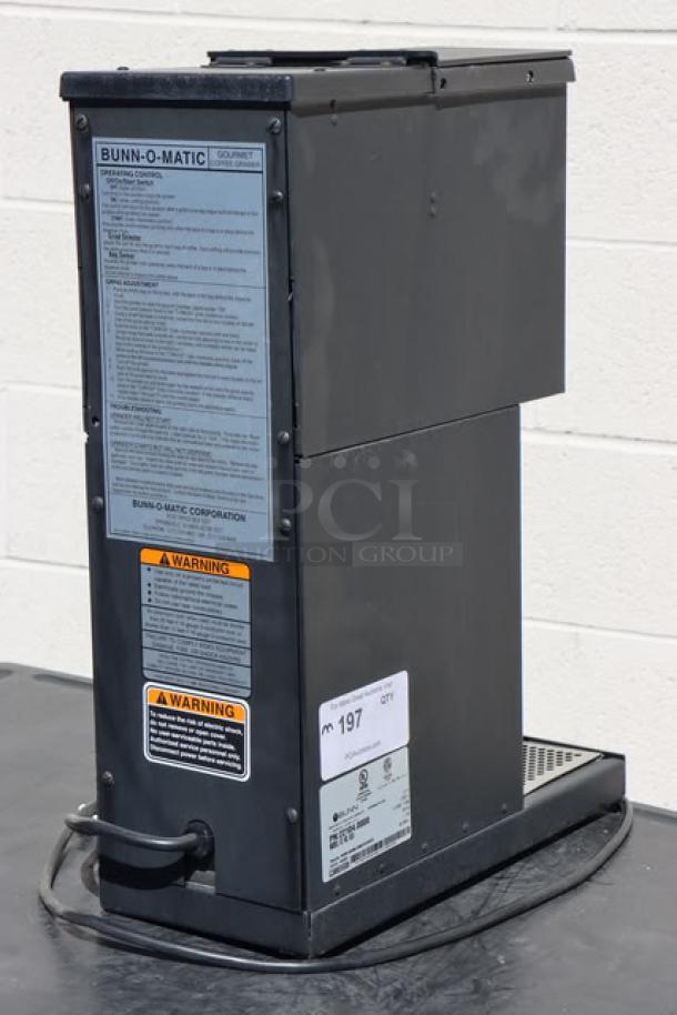 Bunn 22104.0000 G1 HD 1 lb. black bulk coffee grinder, brand new, with warning labels visible. Serial: G100034580.