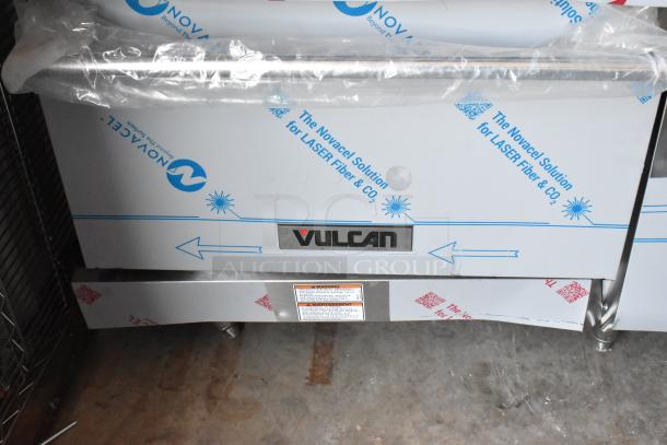 BRAND NEW Vulcan 72SS-6B36GTN 72" gas range with 6 burners, 36" griddle, and 2 ovens. Protective packaging visible.