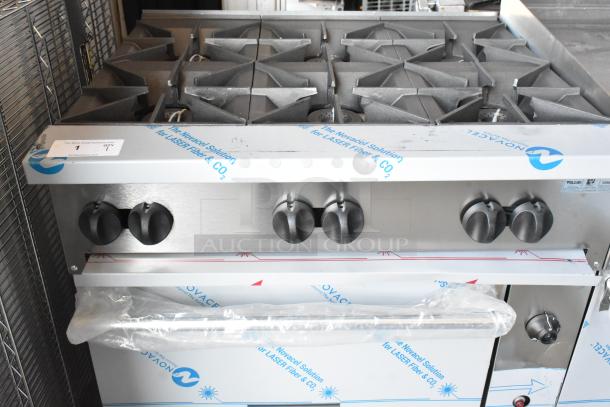 Brand new Vulcan 72SS-6B36GTN commercial range, 6 burners, 36" griddle, 2 ovens, stainless steel, 310,000 BTU, with protective film.