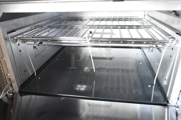 Brand new Vulcan 72SS-6B36GTN commercial range interior, featuring durable oven racks and stainless-steel finish.