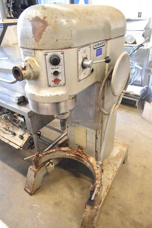 Hobart H 600 T 60-quart commercial mixer, floor style, 230V, 3-phase. Visible wear and signs of rust on metal parts.