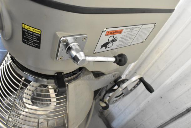 Globe SP40 40 Quart Planetary Mixer, includes bowl, guard, whisk, paddle, and dough hook, 220V, visible caution and warning labels.