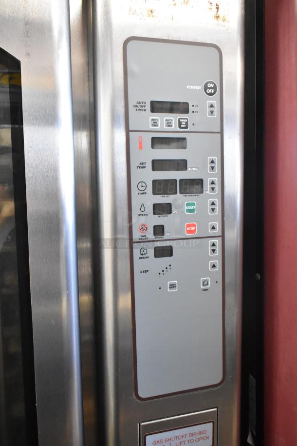 Baxter OV310G stainless steel mini rotating rack oven, natural gas powered, with double pan rack, commercial casters, right side door non-functional.