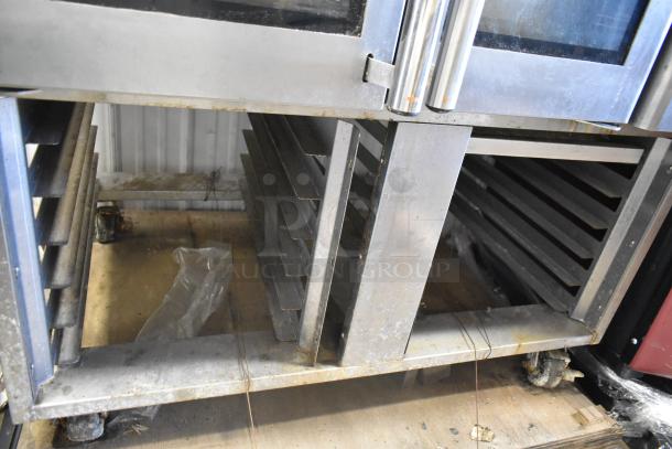 Baxter OV310G stainless steel commercial gas mini rotating rack oven on double pan rack with casters. Right door faulty.