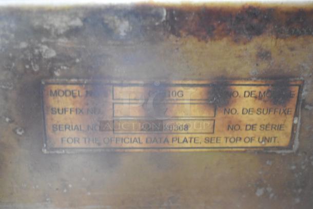 Label on Baxer OV310G oven, showing model OV310G, suffix 7, serial 24-2020368. Right door is non-functional.