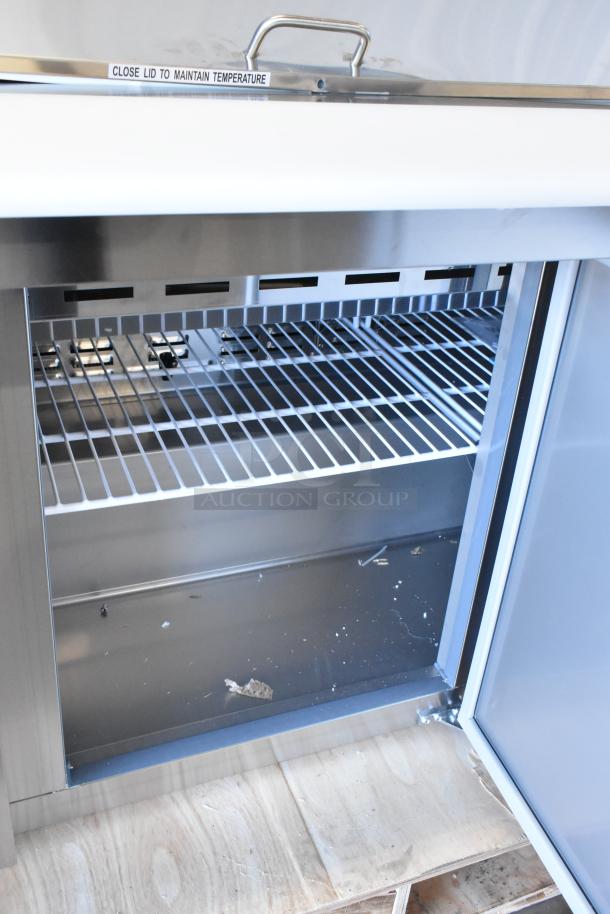 Brand new Avantco 178SSPT71MHC 70" 3-door mega top stainless steel refrigerated prep table. Scratch and dent condition.