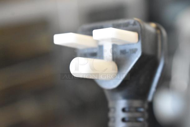 Close-up of a black power plug compatible with the Avantco 177MX40H commercial dough mixer.