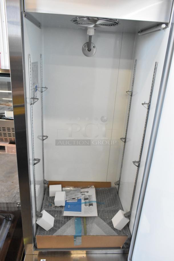 "Brand new Avantco 178A12RHC commercial cooler, 115V, single door, visible packaging, shelves, minor scratches."