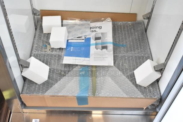 Brand new Avantco 178A12RHC commercial cooler, single door, 115V, 1 phase. Scratch and dent. Bubble wrap visible inside.