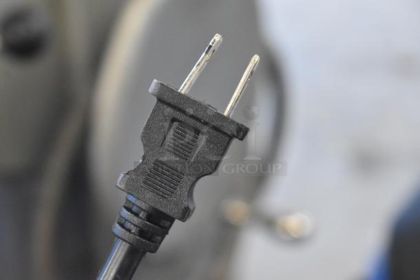 Black power plug of the Lavex 944BJ14126G 26 Gallon Commercial Wet/Dry Vacuum, 100-120 volts.
