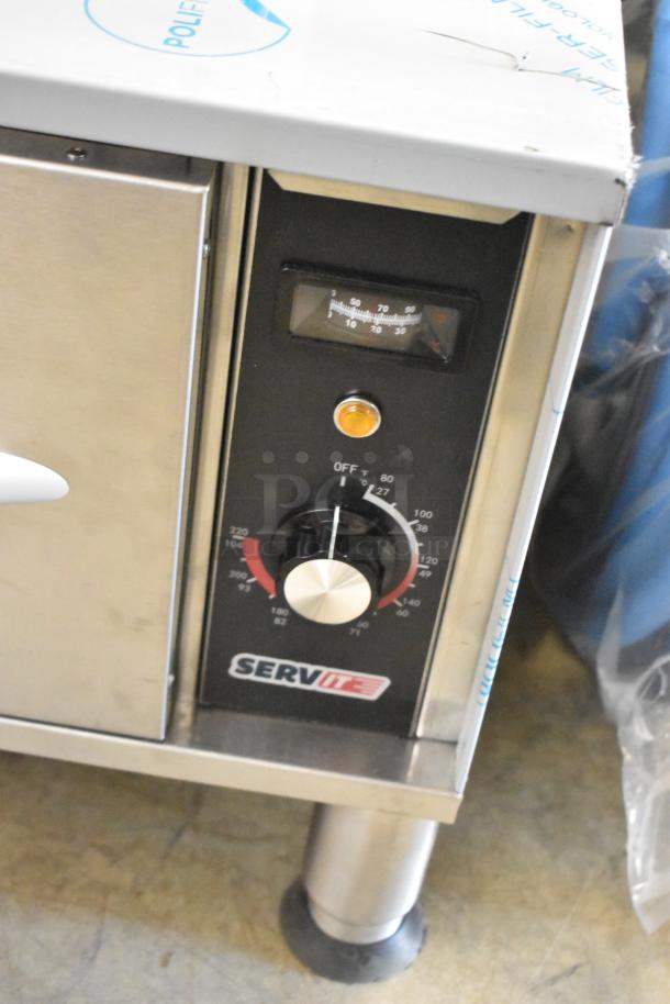 Brand new ServIt 423WDSFS1 single drawer warmer, 120V, 1 phase. Features temperature dial, minimal scratches on surface.