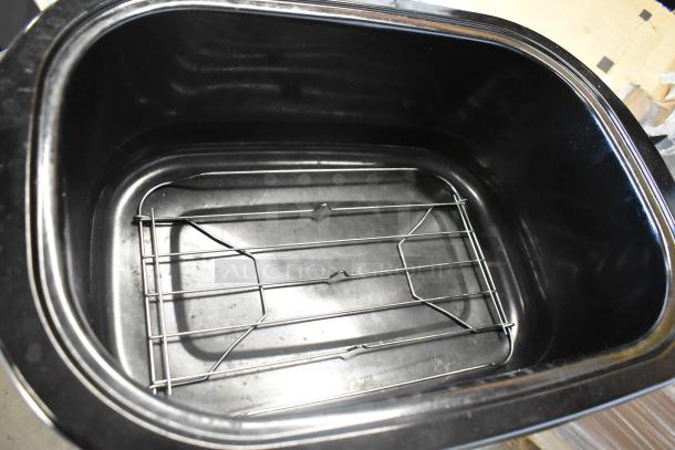 Brand new Galaxy 177ACR22SS 22 Qt. countertop roaster oven/warmer, 120V, 1 Phase, with interior rack. Slight scratch and dent.