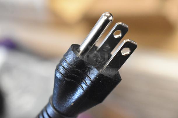Close-up image of a three-prong plug from a Galaxy 177ACR22SS countertop roaster oven, 120 volts, 1 phase.