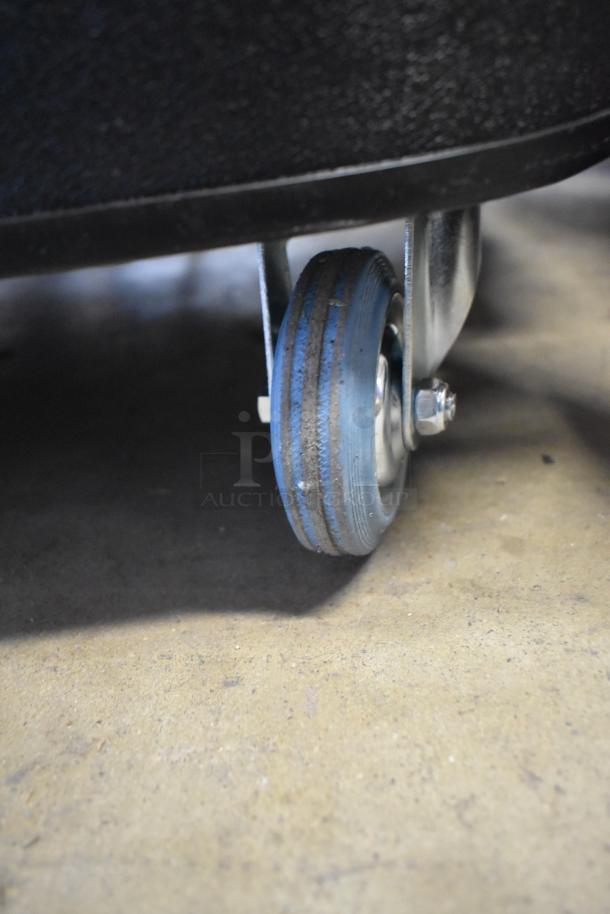 Tornado Taskforce 94236 vacuum wheel detail showing durable design. Model has 20-gallon capacity, squeegee, tools. New condition.