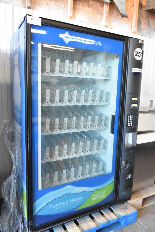 Commercial bottled drink vending machine with bill acceptor, displaying empty racks inside. Marked for 25 cents per bottle.