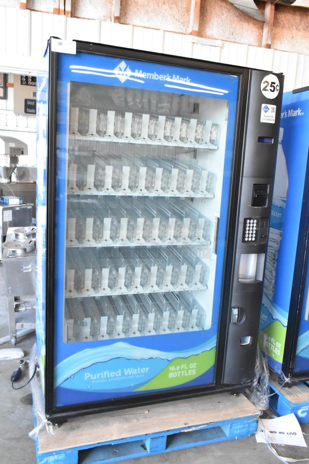 Commercial Member's Mark bottled drink vending machine with bill acceptor, features multiple slots for 16.9 fl oz bottles.