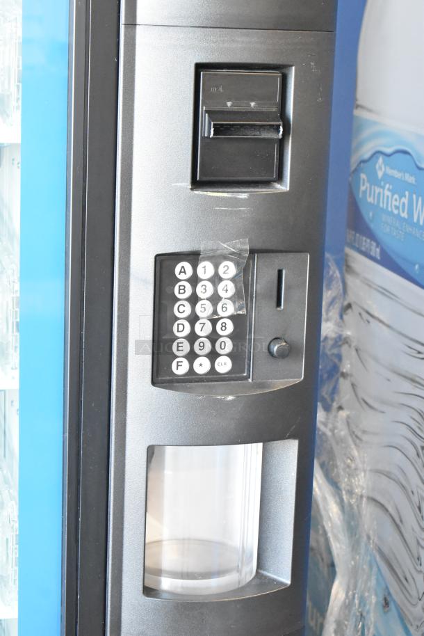 Commercial bottled drink vending machine with bill acceptor and keypad, in good condition.