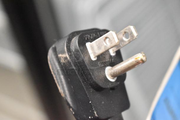 Close-up of a power plug, likely for a 2019 Habco SE18HC Commercial Single Door Reach-In Cooler, showing standard prongs.