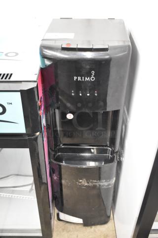 Primo 601088 black bottom load water dispenser, 115V, 1 phase, visible control panel, some surface wear.