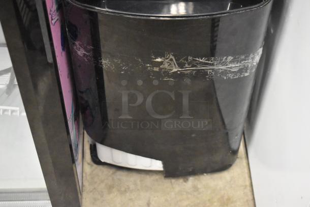 Primo 601088 black bottom load water dispenser, visible wear, 115 volts, 1 phase, ideal for home or office.