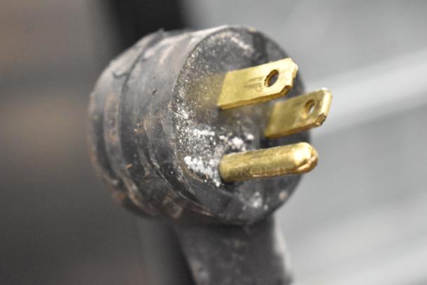 Close-up of the Habco SE12 cooler's three-prong power plug, indicating 115 volts compatibility.