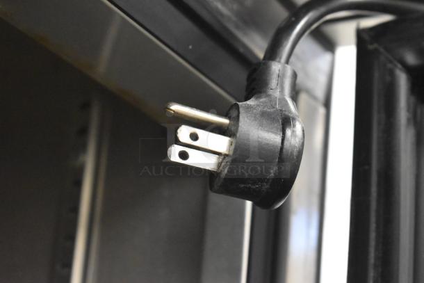 2017 True T-19F Commercial Freezer power cord plug, 115V, 1 Phase, good condition, closeup view.