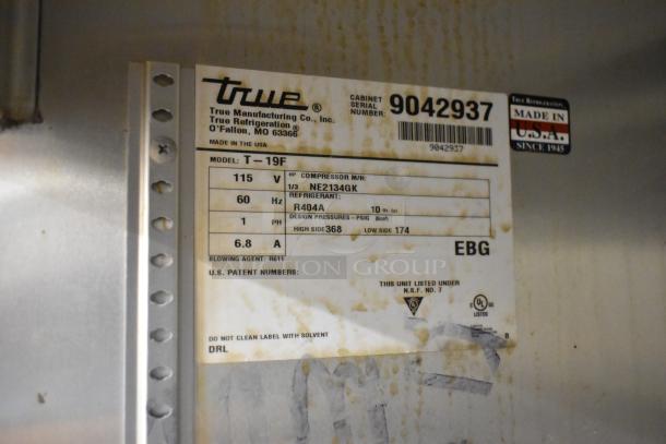 Label on True T-19F commercial freezer. Shows model, 115V, 60Hz, refrigerant R404A, and made in USA details.