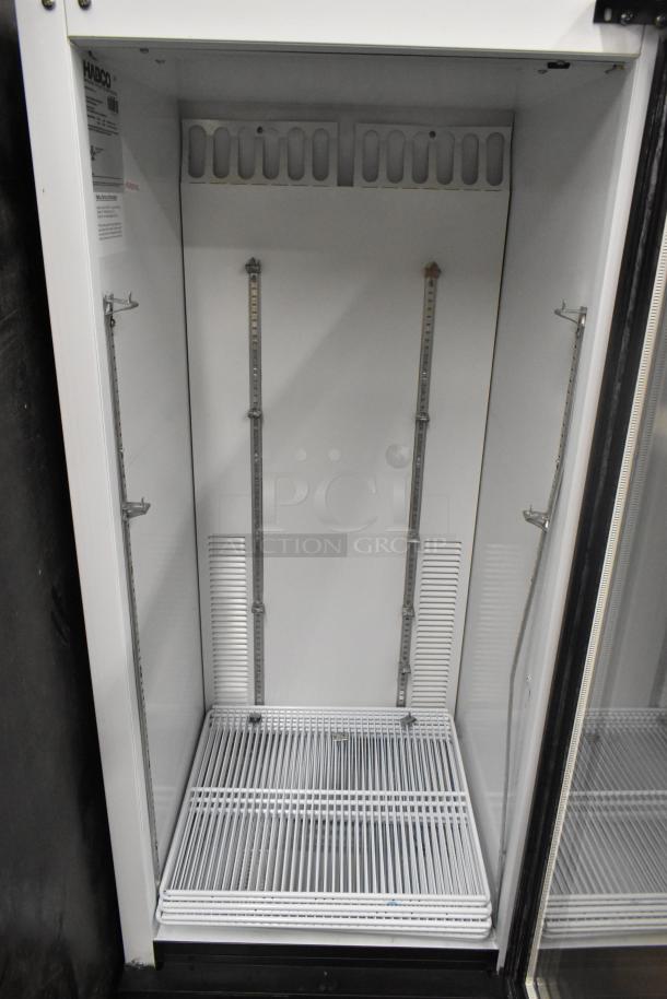 Habco SE12 Commercial Reach-In Cooler with single glass door, white interior, adjustable shelving, 115V, 1 phase, in good condition.