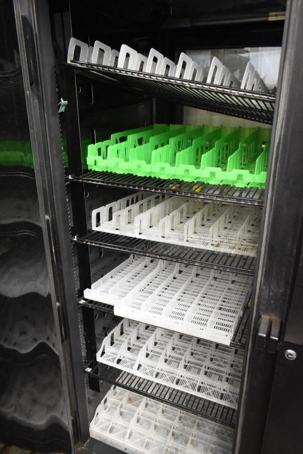 2017 True STG2RPTVLD-2G-2S-HC commercial cooler with wire shelves and dividers, 115V, 1 phase, right door locked.