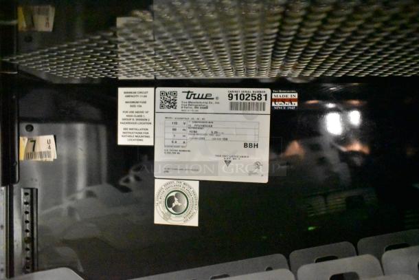 2017 True STG2RPTVLD-2G-2S-HC cooler interior with manufacturer's label, indicating model, 115 volts, 1 phase. Right door locked.