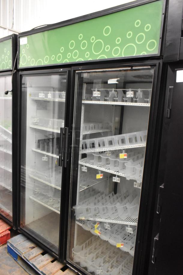 True GDM-52TM-RL-LD commercial 2-door reach-in cooler merchandiser, black exterior, glass doors, shelving included. 115V.