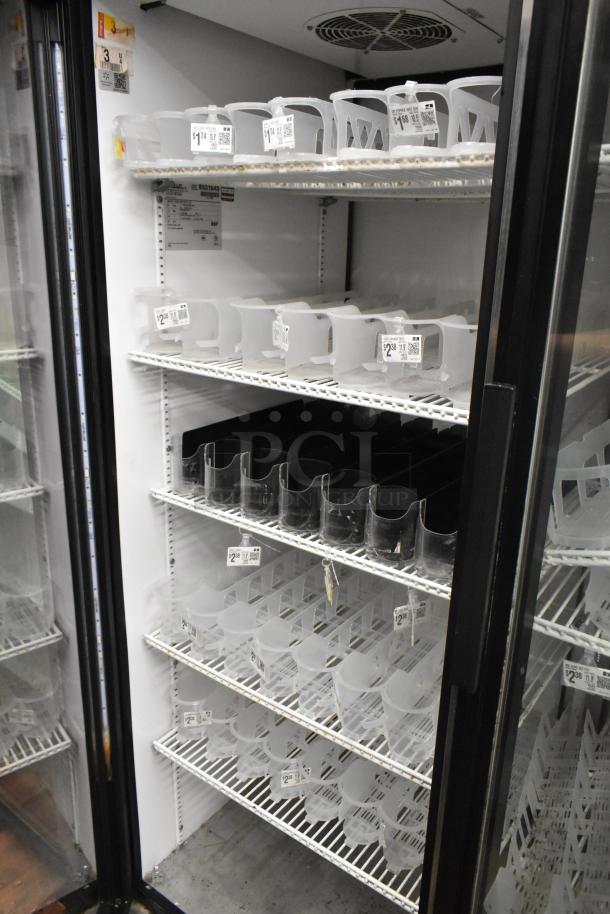 True GDM-52TM-RL-LD commercial cooler, 2 glass doors, shelving, price tags visible, 115 volts, 1 phase.