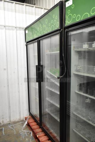True GDM-52TM-RL-LD 2 Door Cooler, commercial reach-in merchandiser, glass doors, 115V, features visible, good condition.