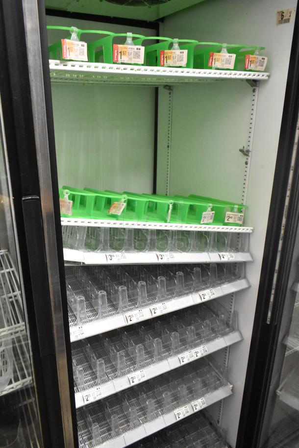 True GDM-52TM-RL-LD cooler with 2 glass doors, adjustable shelves, and visible pricing labels. 115 Volts, 1 Phase.