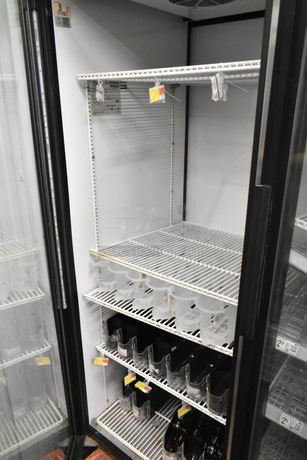 True GDM-52TM-RL-LD commercial 2-door cooler, white interior, adjustable metal shelves, good condition, 115V, 1 phase.