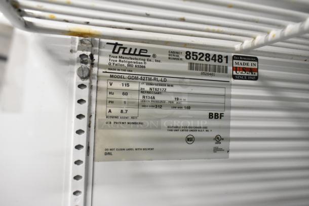True GDM-52TM-RL-LD cooler tag detailing model, 115V, and specs. Features outdoor suitability and NSF listing.