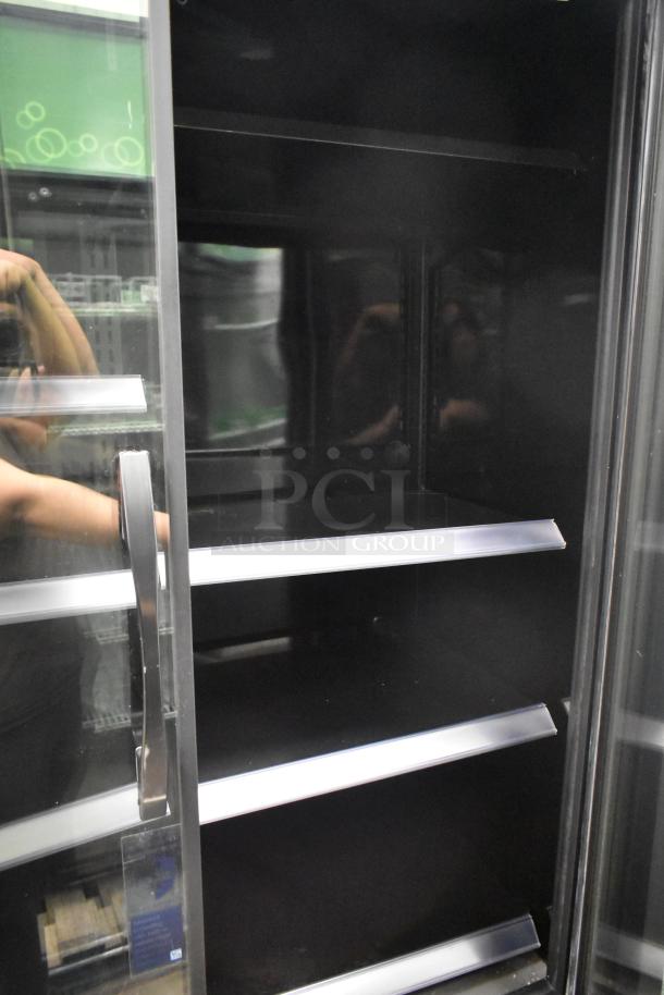 2022 True TVM-48SL-HC Commercial 2 Door Reach In Cooler, sleek glass doors, adjustable shelves, 115V, excellent condition.